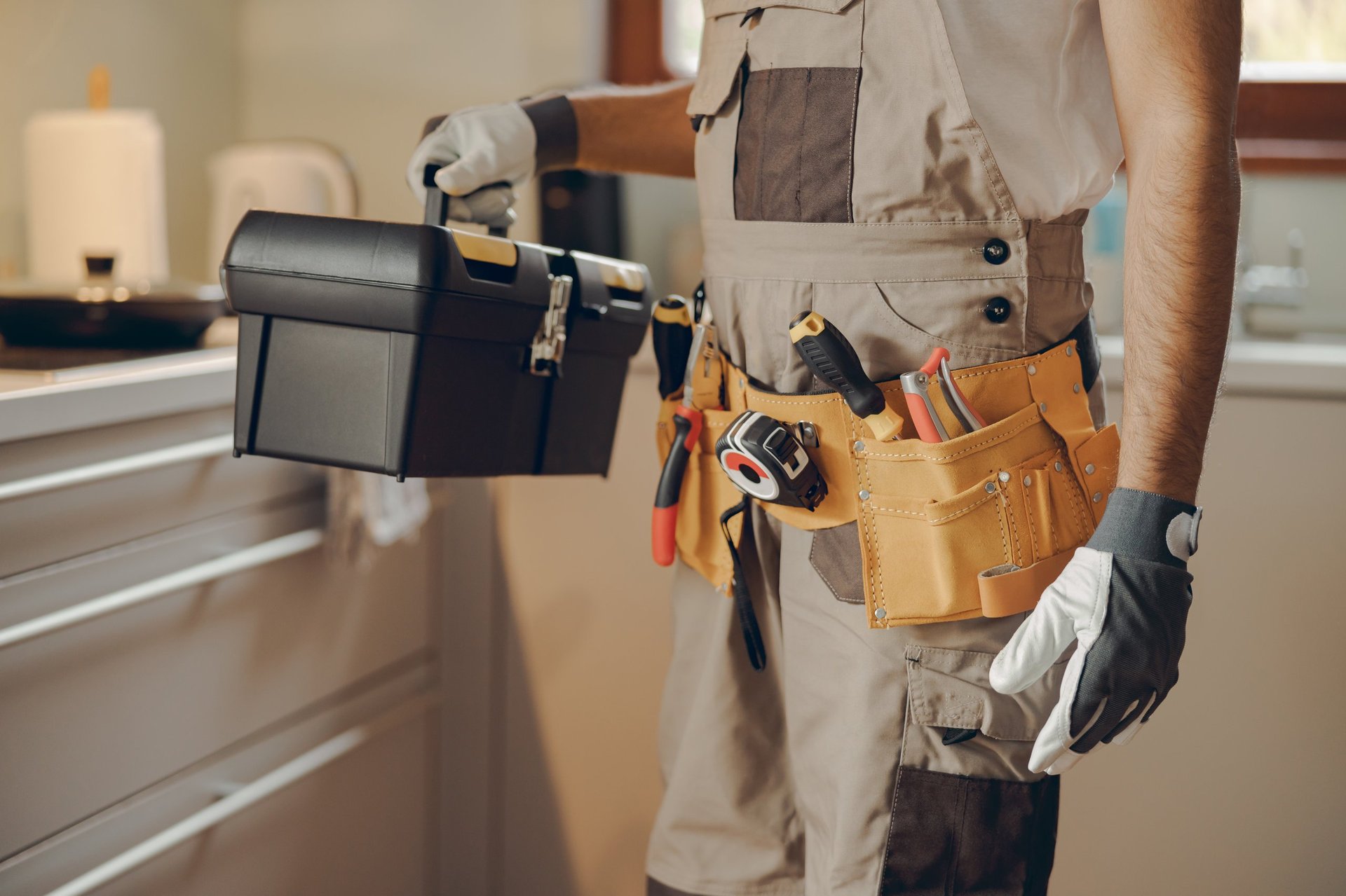 Professional handyman with tool bag